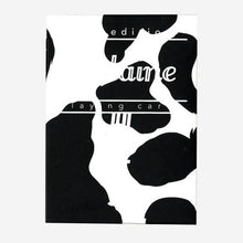 Load image into Gallery viewer, Black and white abstract design of a cow pattern with fontaine branding on a white background
