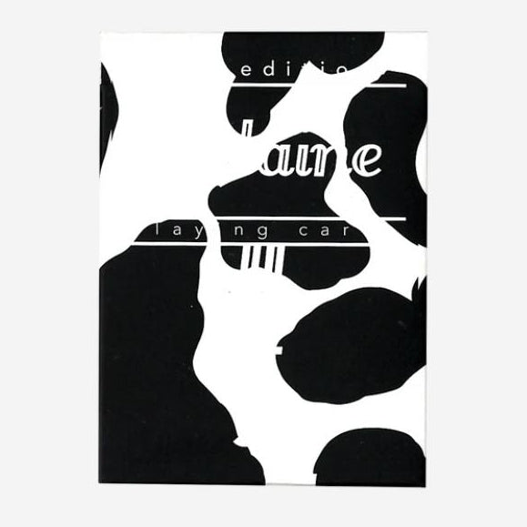 Black and white abstract design of a cow pattern with fontaine branding on a white background
