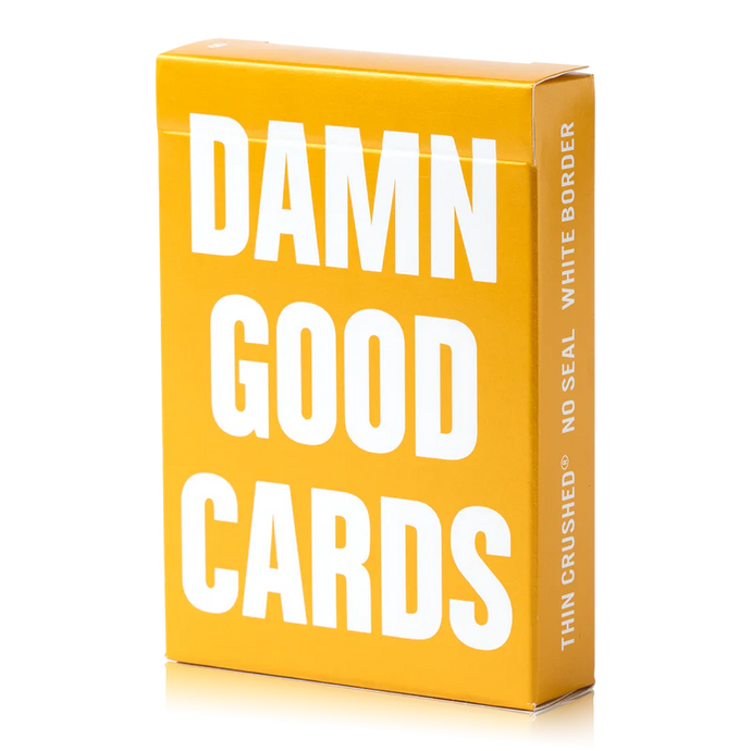 Gold card box with 'Damn Good Cards' text on a white background